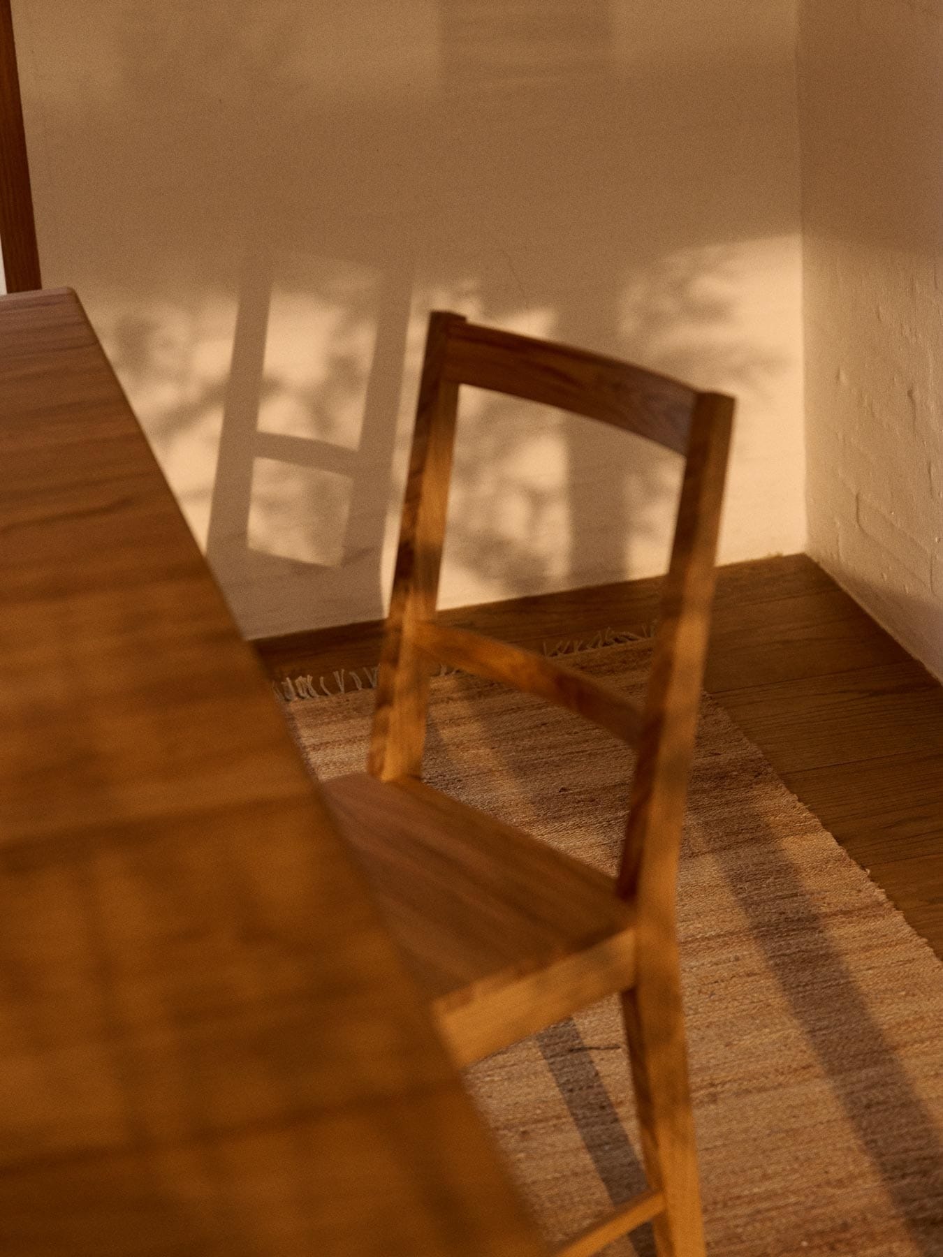 oak chair and dining table on a hemp rug