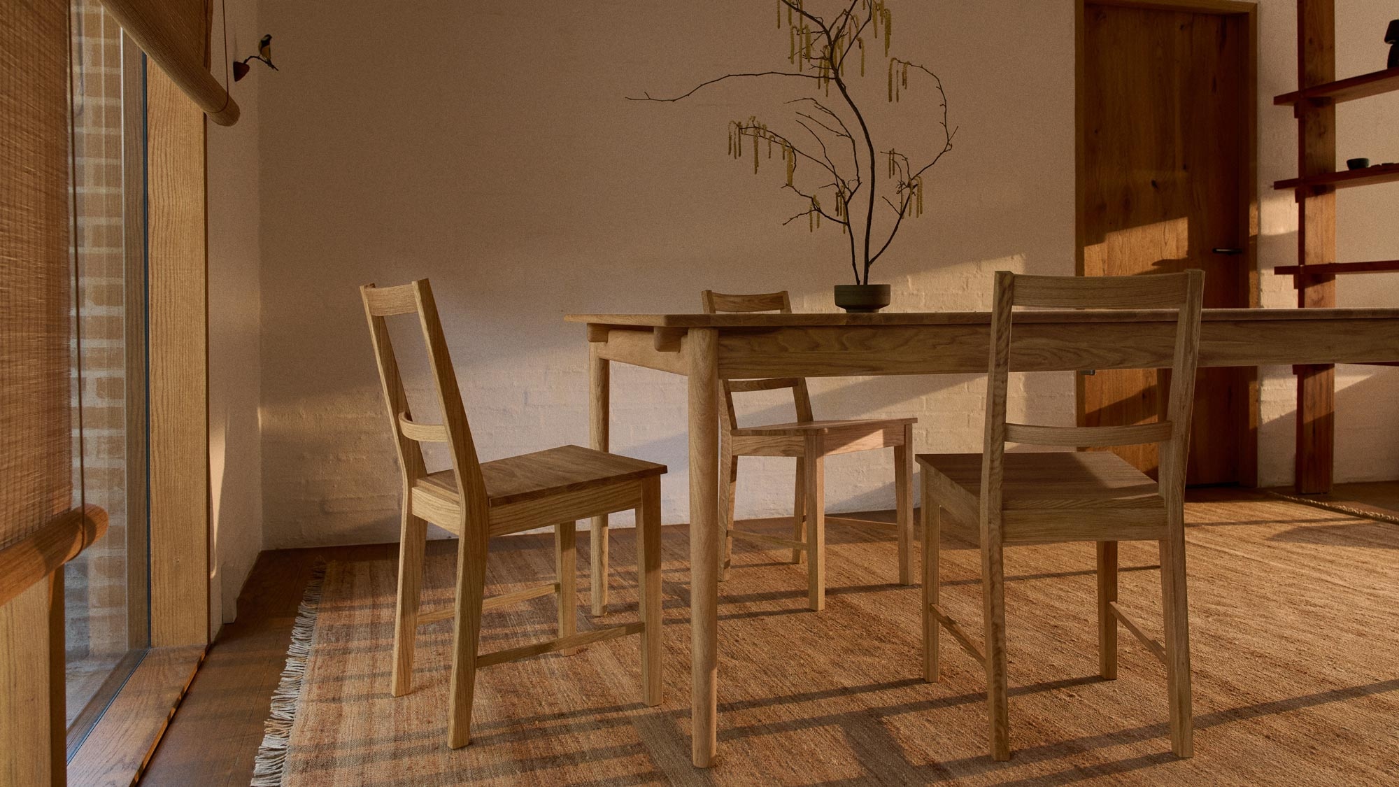oak dining table and chairs on a large hemp rug
