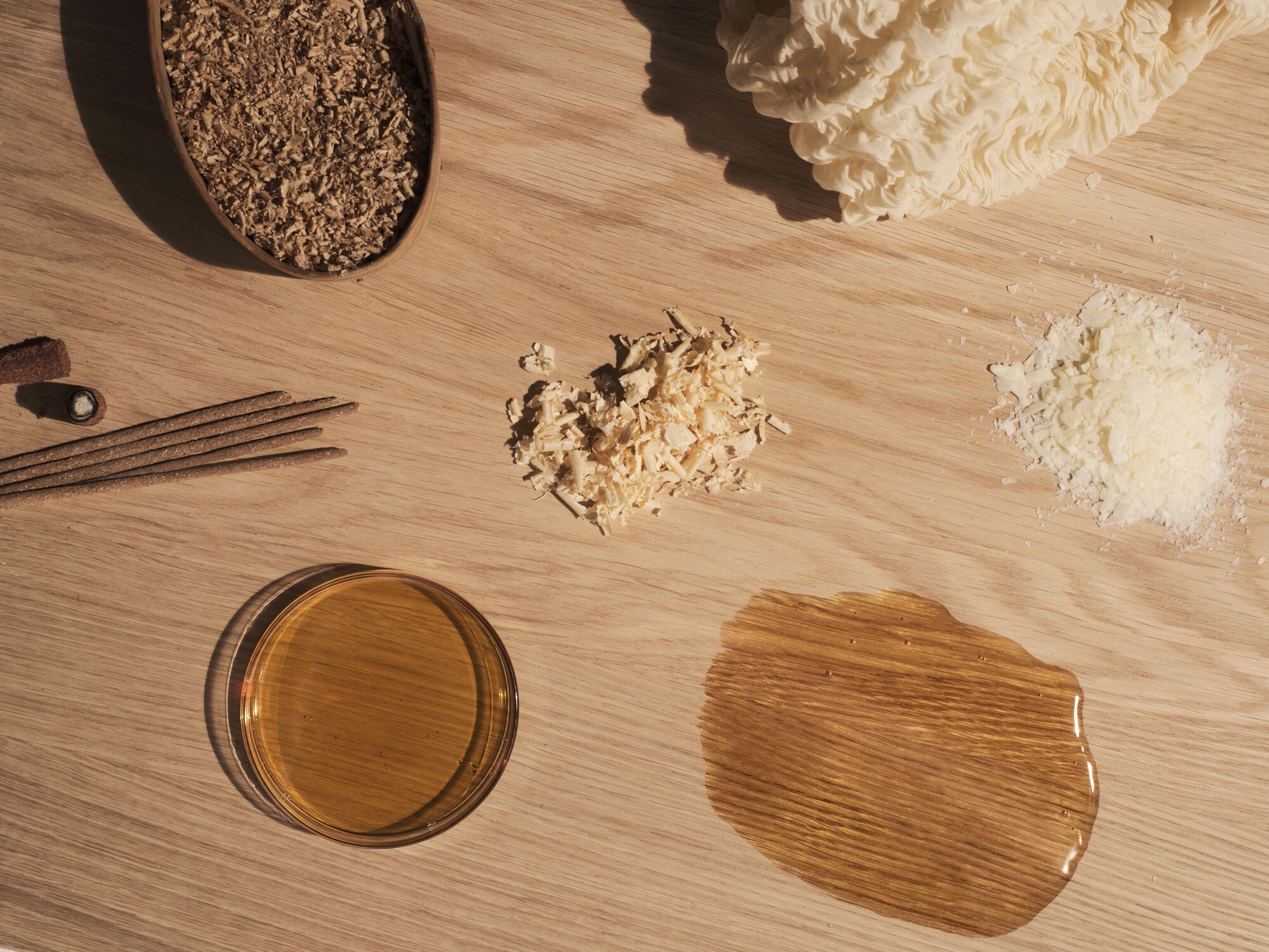Oak table top with soap flakes and oil on top