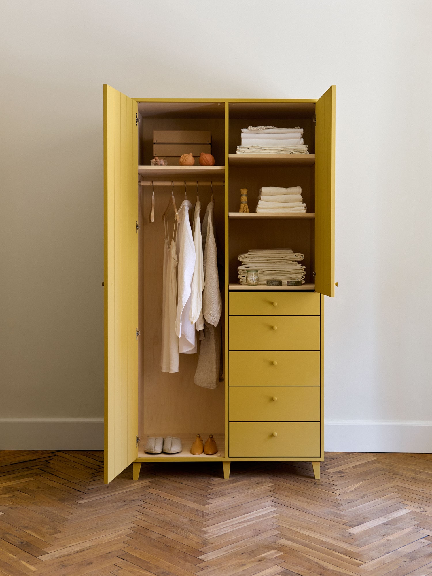 wardrobe with open doors, painted with yellow egg-and-oil tempera solid throughout